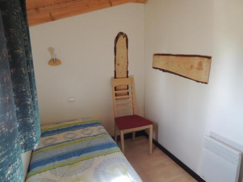 Ένα ή περισσότερα κρεβάτια σε δωμάτιο στο chalet LE NORMANDIE