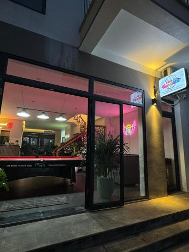 a restaurant with a pool table in the window at Liverpool House Mộc Châu in Mộc Châu