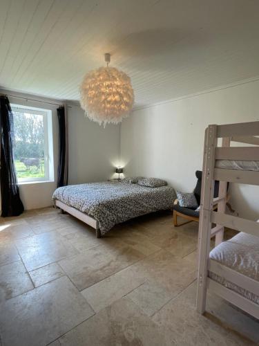 Postel nebo postele na pokoji v ubytování Le Saule