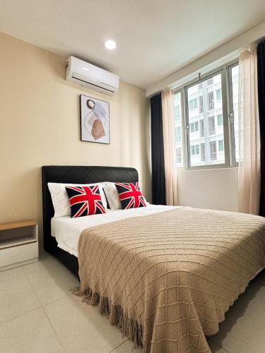 a bedroom with a bed and a window at MetroCity Square Condominium-3R2B-9 Pax in Kuching