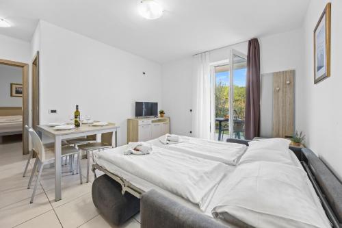 Postel nebo postele na pokoji v ubytování Residence Kamenjak Runke