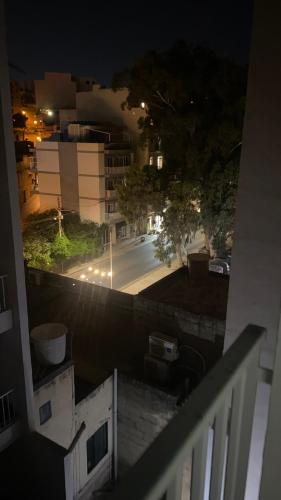 a view of a street at night from a balcony at Joes Court in Misraħ Il-Barrieri