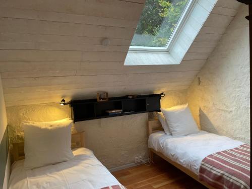 Postel nebo postele na pokoji v ubytování Manoir de Goaz Froment trois Gîtes de charme 3 étoiles