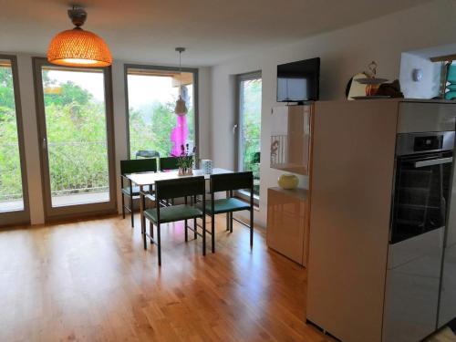 a kitchen and dining room with a table and chairs at Apartment Sonnenschein in Bühl