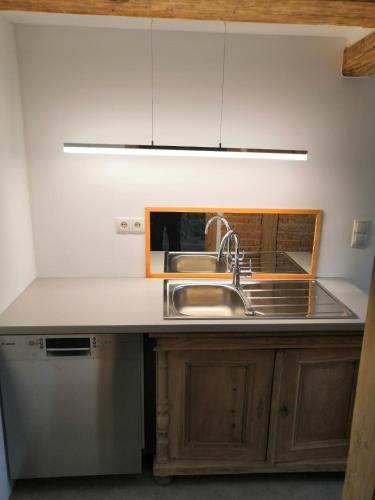 a kitchen with a sink and a counter top at Apartment Sonnenschein in Bühl
