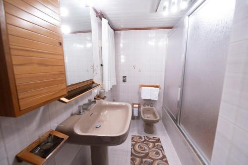 a bathroom with a sink and a toilet at Domus61 in Marsala