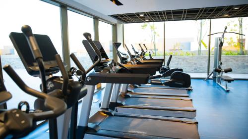 a row of tread machines in a gym at Durrat Jalmouda Hotel in Al Jubail