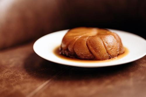 a pastry on a white plate on a table at Hôtel La Sivolière in Courchevel