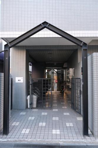 an entrance to a building with an open door at marron home 大阪 in Osaka
