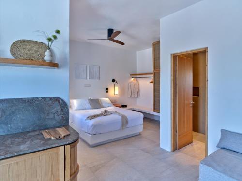 a bedroom with a bed and a couch at Casa Stellino in Kampos Paros