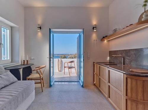 a kitchen with a view of the ocean from a room at Casa Stellino in Kampos Paros