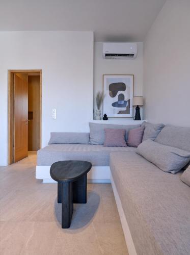 a living room with a couch and a table at Casa Stellino in Kampos Paros