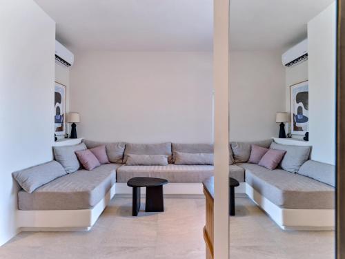 a living room with a couch and a table at Casa Stellino in Kampos Paros