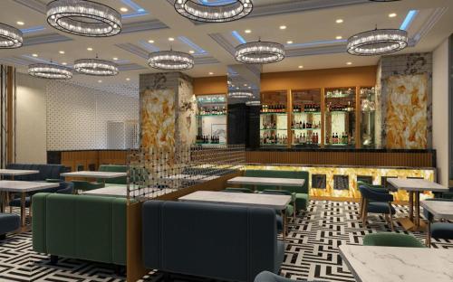 a restaurant with tables and chairs and a bar at Hotel Mumbai House, Vashi, Navi Mumbai in Navi Mumbai