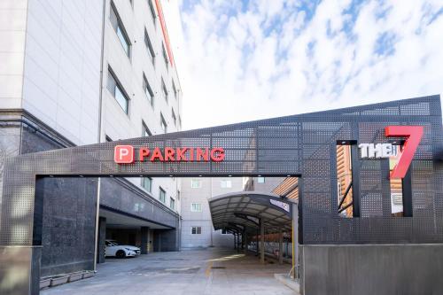 a building with a sign that reads p parking at The 7 Business Hotel in Gumi