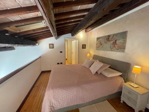 Ένα ή περισσότερα κρεβάτια σε δωμάτιο στο Elena Casa Turistica