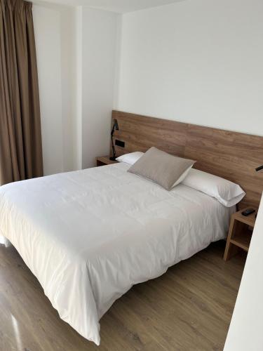 Ένα ή περισσότερα κρεβάτια σε δωμάτιο στο Hostal Márquez