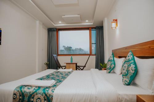 En eller flere senge i et værelse på Saj Heritage