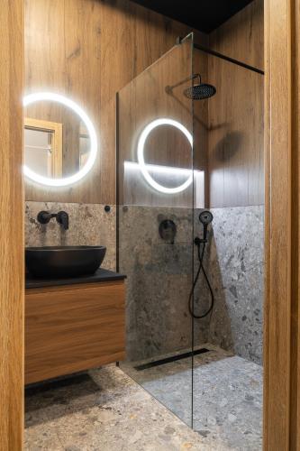 a bathroom with a sink and a shower at RentPlanet - Kępa Mieszczańska in Wrocław