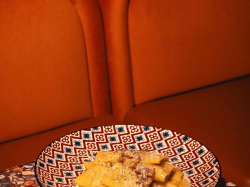 a plate of food sitting on top of a table at Mercure Roma Cinecittà in Rome