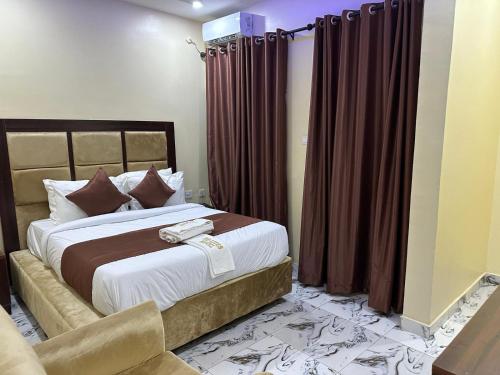 Postel nebo postele na pokoji v ubytování De-Lites Hotel