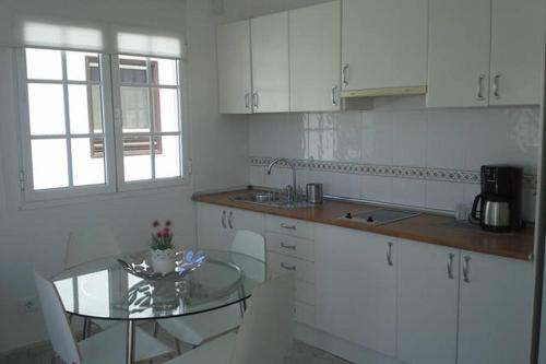 A kitchen or kitchenette at Elena Beach House Lanzarote