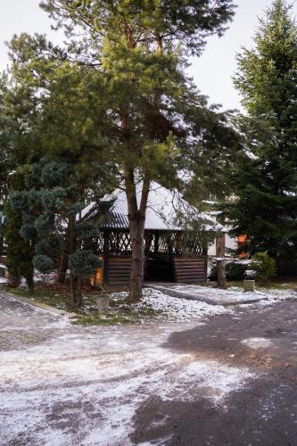 a house with a tree in front of it at Млин готель-ресторан-спа in Tyapche