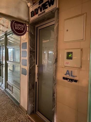 an entrance to a building with a revolving door at BayView Nazaré in Nazaré