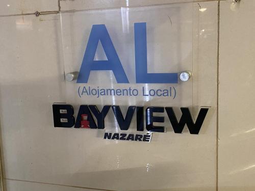 a sign for aaa on the side of a window at BayView Nazaré in Nazaré