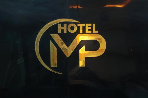 a close up of a hotel logo on a window at Hotel meet palace in Ambli Road