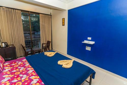 Postel nebo postele na pokoji v ubytování Hotel 7 Seas Vagator