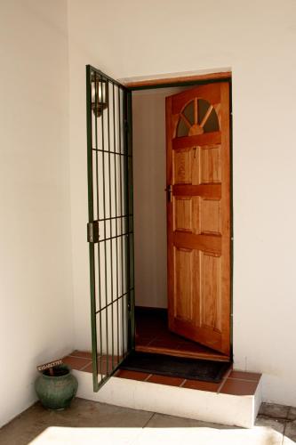 an open door in a room with at 4 Rothman Street B&B in Graaff-Reinet
