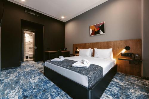 Postel nebo postele na pokoji v ubytování Hotel Splendid Tbilisi