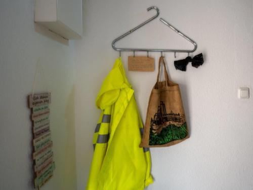a bag is hanging on a hook on a wall at 194 Fewo Dat LütjeHuus mit Dachterrasse im ersten Stock in Lütjenburg