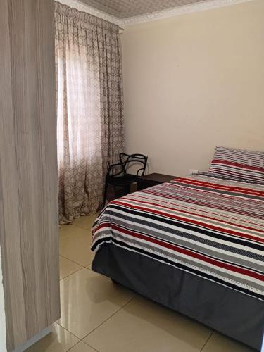 Ένα ή περισσότερα κρεβάτια σε δωμάτιο στο Cozy 2 Bedroom
