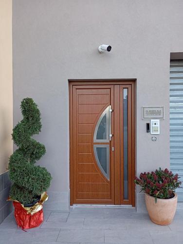 a wooden door on the side of a building at Morcone B&B Affittacamere in Morcone