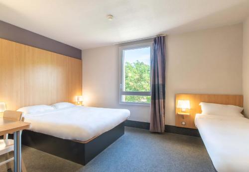 Postel nebo postele na pokoji v ubytování B&B HOTEL Alès - Pôle Mécanique