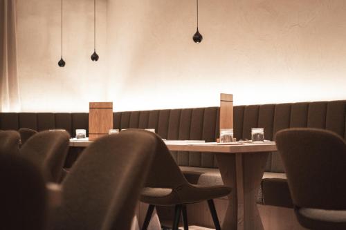 a dining room with a table and chairs at Haunold Homes in San Candido