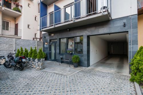 a motorcycle parked in front of a building at VV hotel & apartments in Brno