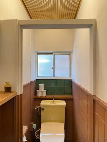Koupelna v ubytování 一日一組限定の珈琲宿-14hikari coffee inn-