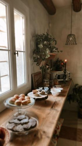 a wooden table with food on top of it at Il Glicine - Natural BnB in Castello di Godego