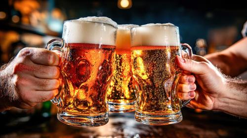 two people holding up two glasses of beer at NTV Smoky Garden in Owariasahi