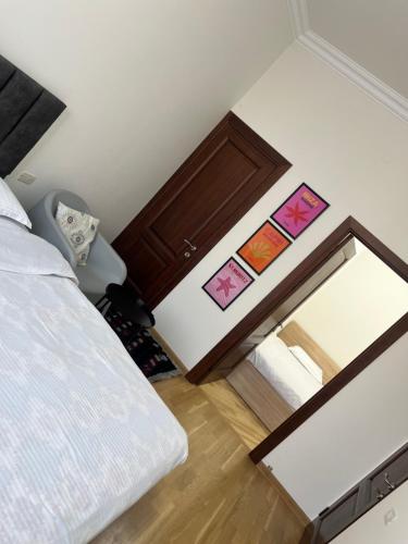a bedroom with a mirror and a bed at Velvet Vouge Hostel in Yerevan