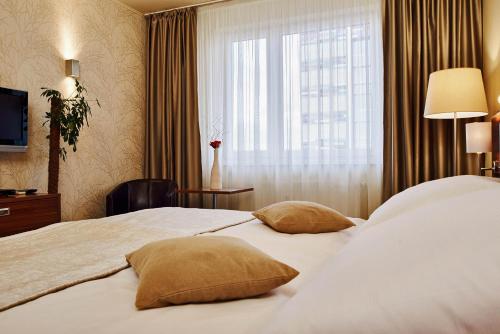 Ένα ή περισσότερα κρεβάτια σε δωμάτιο στο Privilege Apartments