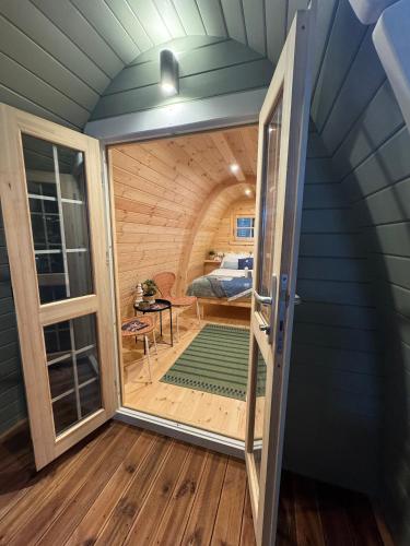 a room with a door leading to a bedroom at Pod - Camp Diekirch in Diekirch