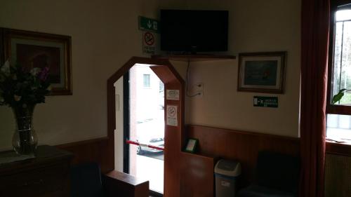 a room with an entrance to a room with a vending machine at Albergo Sonia in Florence