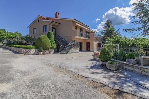 a large house with a driveway in front of it at Apartment Lucia in Central Istria in Gračišće