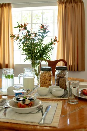 a wooden table with food on top of it at 4 Rothman Street B&B in Graaff-Reinet