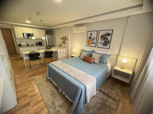 Un pat sau paturi într-o cameră la Hotel Flat Afonso Pena e Centro de Convenções Campo Grande