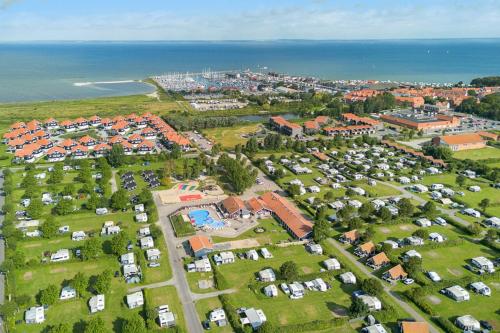 an aerial view of a parking lot next to the ocean at First Camp Bogense Strand Camping & Cottages in Bogense